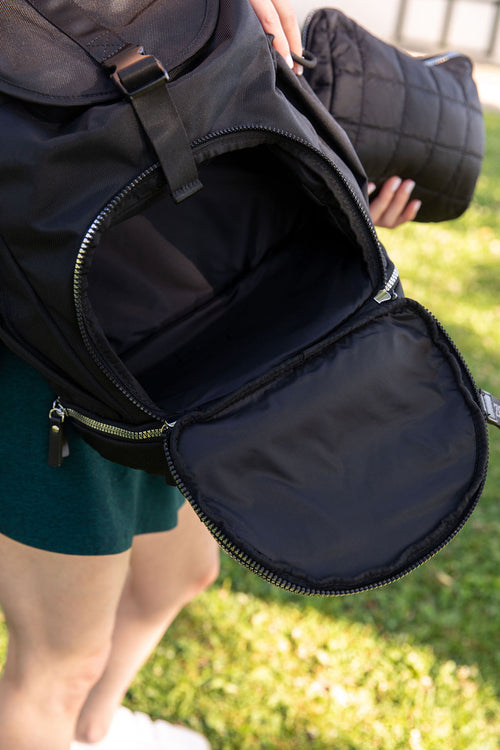 Crown Carryall travel diaper bag open showing interior pockets and organization